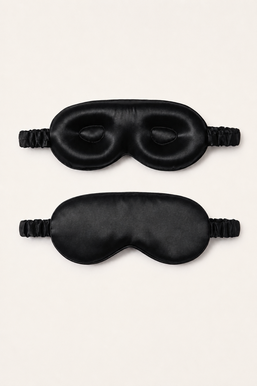 Front and back view of a black mulberry silk 3D sleep mask